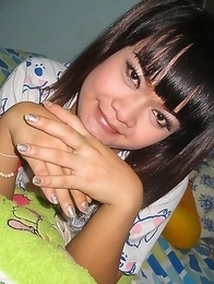 Teen Ladyboy Ping fucks herself with a big green cucumber