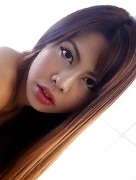 Busty Thai ladyboy Nadea strips to her big boobs and bare cock