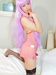 Cute Kanato can fullfill your fantasies in her purple wig, lingerie, and fishnet stockings.